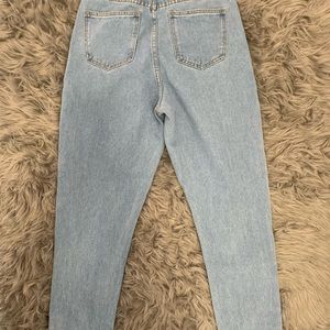 Princess Polly light washed, high waisted jeans.